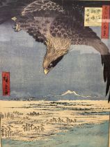 After Utagawa Hiroshige, colour print, an eagle flying over a snowy river landscape, framed. (23in x