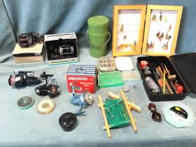 Miscellaneous fishing tackle including boxed Abu Garcia multiplier reels, fly boxes, lines, spinning