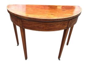 A Georgian mahogany turn-over-top tea table, the crossbanded top above ebony & boxwood strung