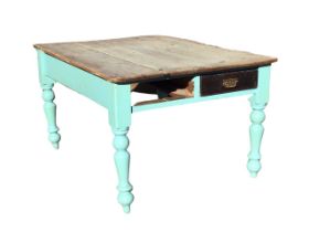 A Victorian pine kitchen table, the rectangular scrubbed top above a painted base with two frieze
