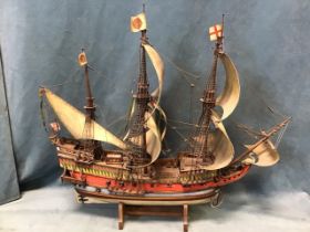 A scratch built model of an Elizabethan three-masted galleon in full sail, the White Swan, mounted