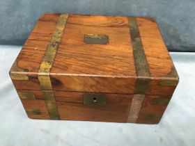 A Victorian brass bound walnut writing slope, having fitted interior and military style mounts - A/