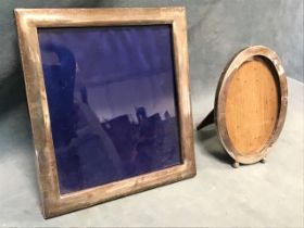 Two hallmarked silver photo frames on easel stands - rectangular and oval, Glasgow 1902 & Birmingham