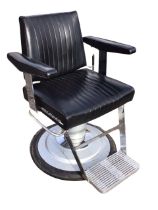 A chromed vinyl upholstered adjustable barbers chair, the tapering back and seat with ridged