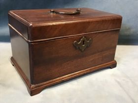 A George III rectangular mahogany tea caddy, the moulded cockbeaded cover with brass swan-neck