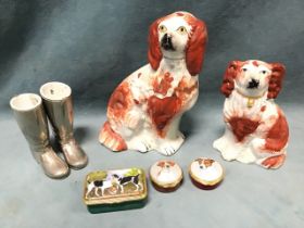 A graduated pair of Victorian Staffordshire wally dogs with brick-red coats and painted faces; three