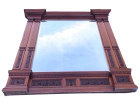 A monumental Victorian mahogany renaissance style mirror, the egg-and-dart moulded cornice above a