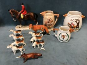 A collection of fox hunting ceramics - a German pottery Hertwig mounted huntsman, seven Beswick