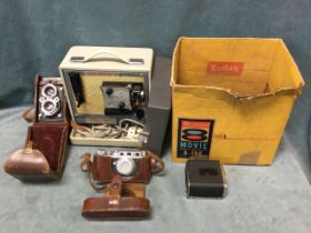 A leather cased Microcord TLR camera; a boxed Brownie 8mm movie projector; a Kiev 6 x 6 Hassalblad