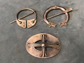 Two hand-made silver Roman/Viking style plaid buckles with tapering swinging pins; and a silver