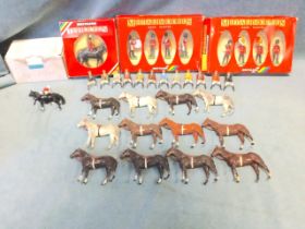 A collection of twelve Britains horses & jockeys, the mounted riders in miscellaneous stable colours