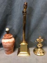 An alabaster jar tablelamp with internal illumination; a tall brass classical fluted column