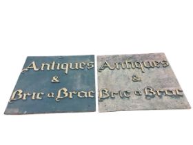 A pair of antique & bric-a-brac shop signs, the painted boards with gilt lettering, mounted for