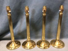 A set of four contemporary fluted brass column tablelamps, on circular moulded bases. (13.5in) (4)