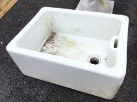 A rectangular glazed belfast sink with integral overflow. (24.5in)