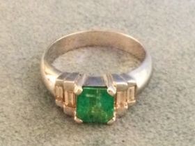 A Colombian emerald diamond ring on an 18ct band, the square cut central stone of 1.11 carats