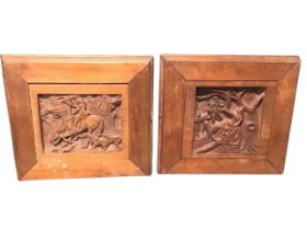 A pair of square carved nineteenth century panels depicting classical scenes, in walnut frames