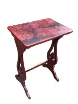 A C19th Japanese lacquered occasional table, the rectangular top with a bird in a prunus bush before