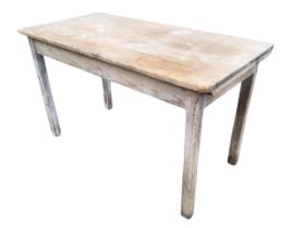 A Victorian pine kitchen table, the rounded rectangular top above a plain apron, raised on square