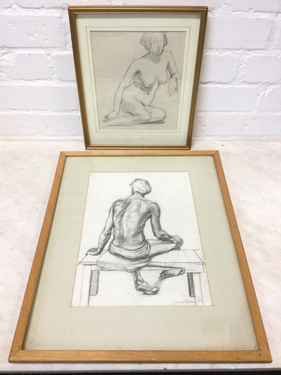 Tony Ogden, pencil study of a seated figure on bench, signed, mounted & framed; and a pencil nude