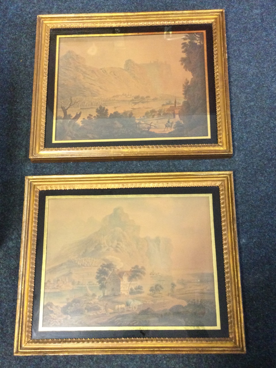 A pair of C18th handcoloured mezzotints, views on the Rhine with ruined castles on clifftops,