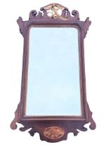 A C19th Georgian style mahogany fretwork mirror with pierced scrolled crest centered by gilt ho-ho