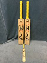 A pair of Woodworm Cricket Company cricket bats The Torch models, and a similar miniature, two