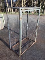 A rectangular metal cage with hinged door and wirework mesh panels to square frame. (39.25in x 19.