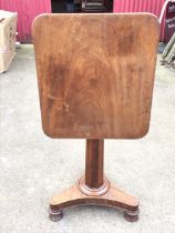 A William IV mahogany occasional table, the rectangular rounded top tilting on an octagonal