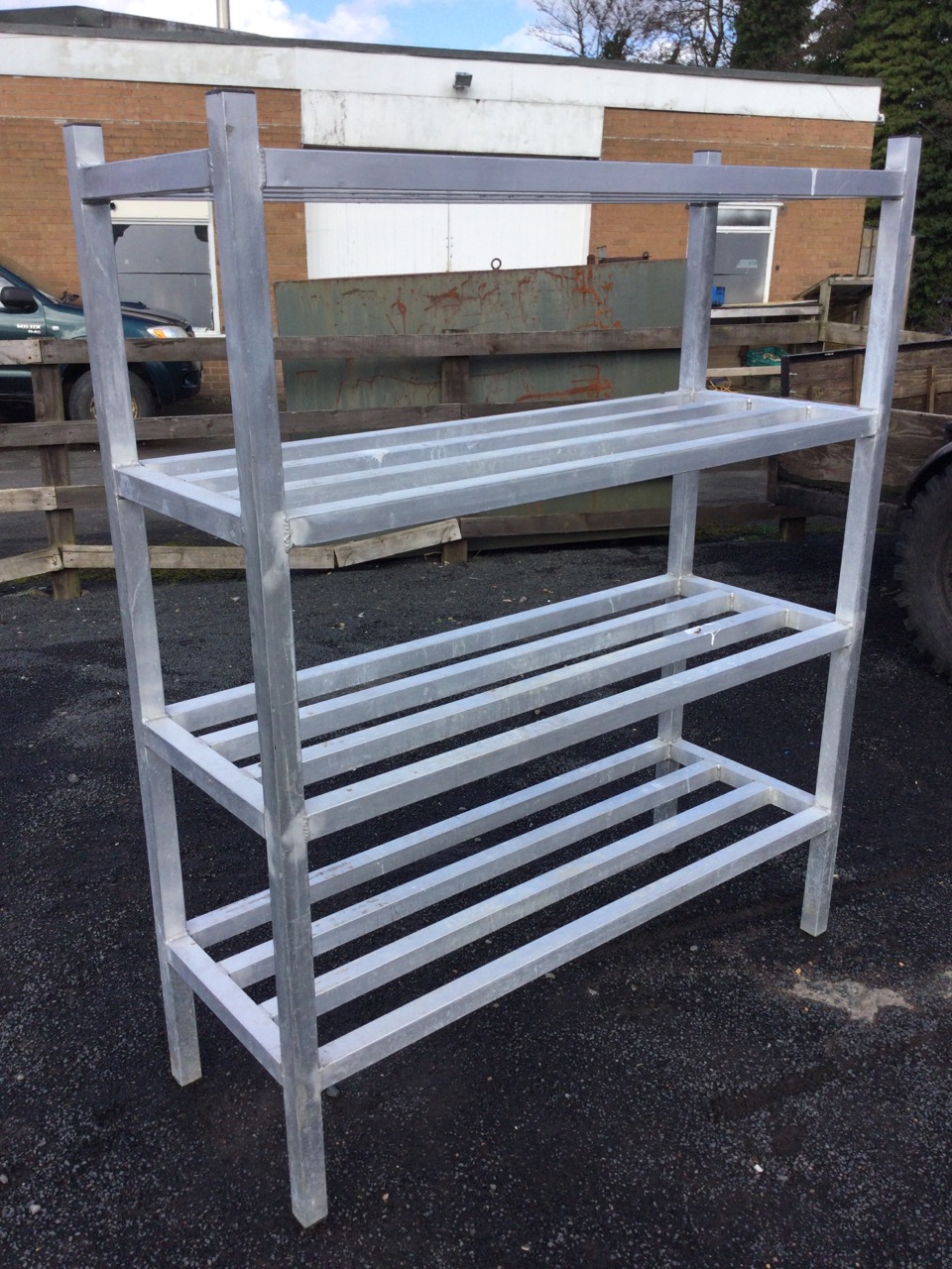 A set of 4ft free-standing aluminium shelves of box section, with four platforms of battens on - Image 3 of 3