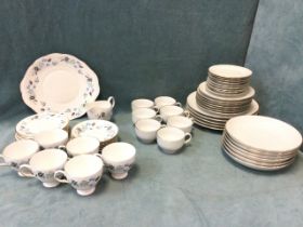A contemporary Harmony gilt edged white porcelain dinner service with dinner plates, side plates,