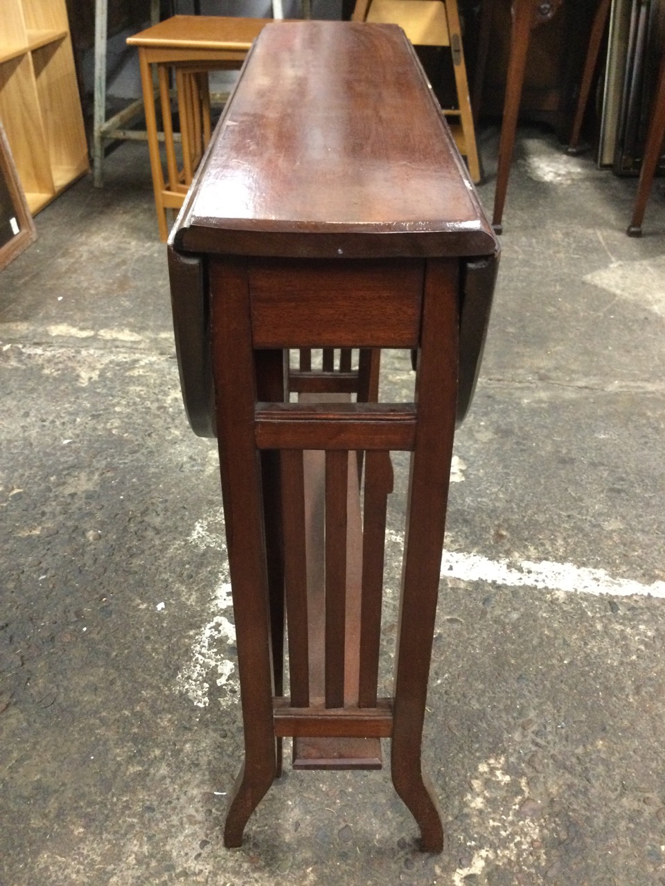 An Edwardian mahogany sutherland table with oval moulded top and two leaves supported on swing legs, - Image 3 of 3
