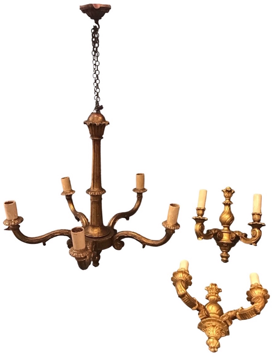 A giltwood five-light chandelier with tapering fluted column and boss supporting five leaf