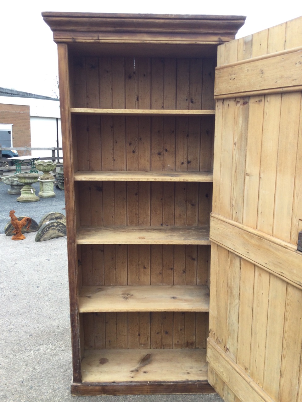 A Victorian tongue & grooved pine cupboard with hinged door enclosing shelves beneath a moulded - Image 2 of 3