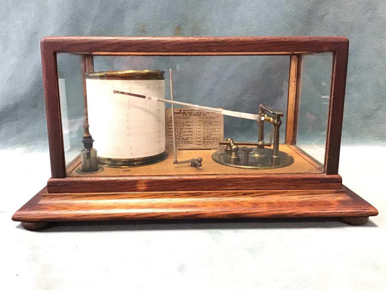 An oak cased brass barograph by M Cohen & Son of Bradford, with rectangular glazed cover on a