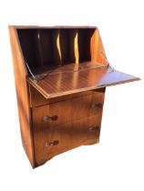 A 60s walnut bureau with fallfront and pigeonholes to interior, above three drawers with pierced
