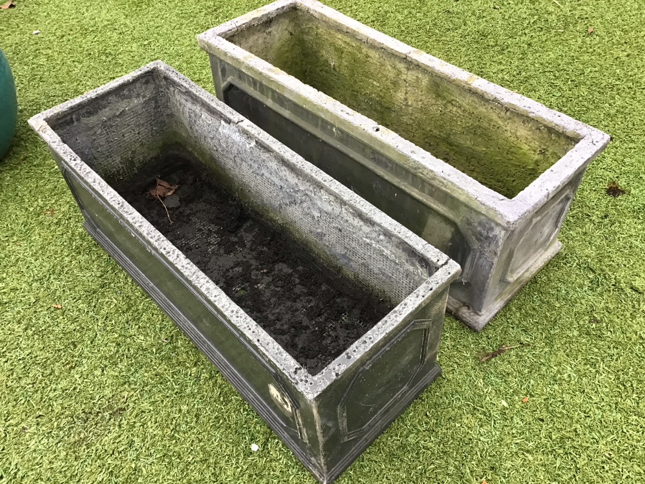 A pair of rectangular faux lead garden troughs with moulded plinths and rims, having panelled sides. - Image 3 of 3