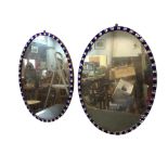 A pair of C18th Irish oval pier mirrors with period mercury plates within alternating blue and clear