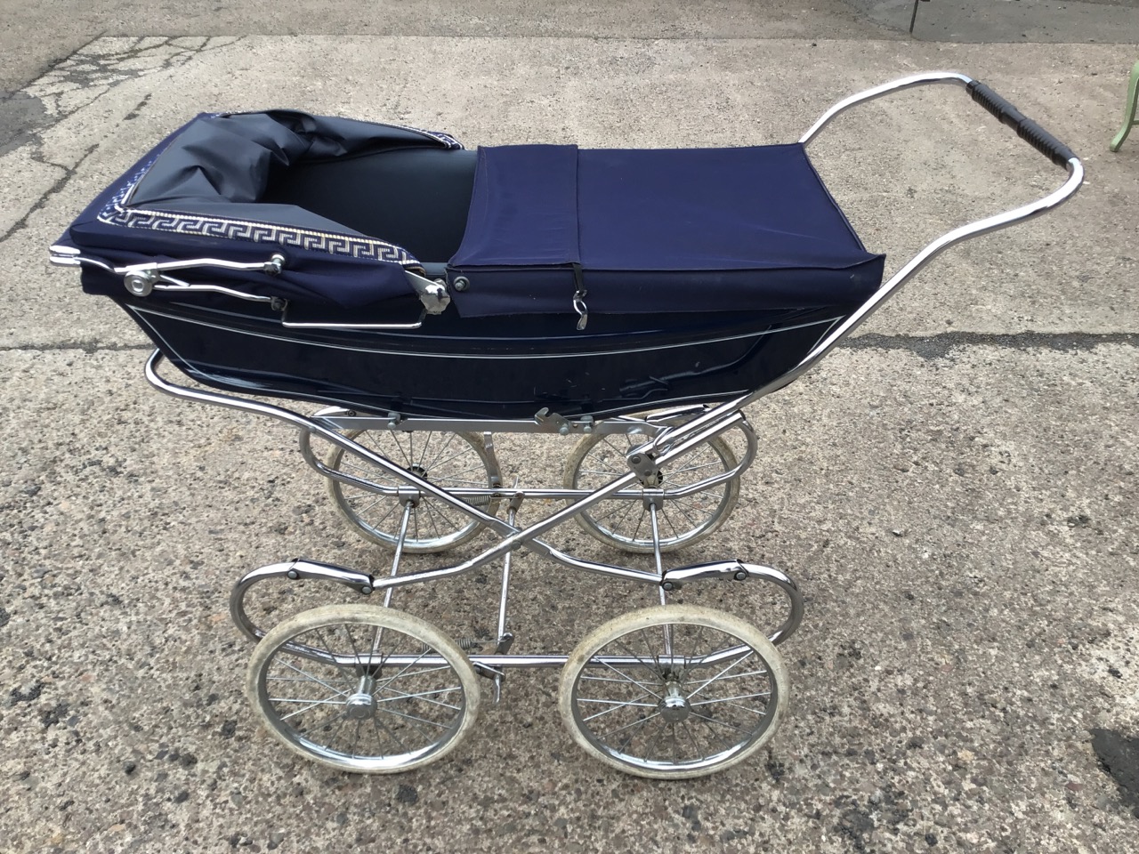 A Mothercare traditionally styled pram, the lined body with folding canvas hood, on a chromed - Image 2 of 3