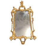 A Chippendale style rococo giltwood wall mirror, the acanthus and foliate scrolled crest above a