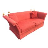 A Laura Ashley knole house sofa with drop arms and turned finials to roped back, having loose