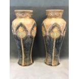 A pair of Royal Doulton stoneware art nouveau inverted baluster vases with tubelined stylised