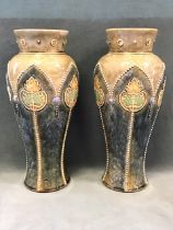 A pair of Royal Doulton stoneware art nouveau inverted baluster vases with tubelined stylised