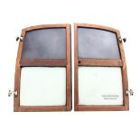 A pair of Morris Traveller rear doors with metal and glazed panels in shaped oak frames, complete
