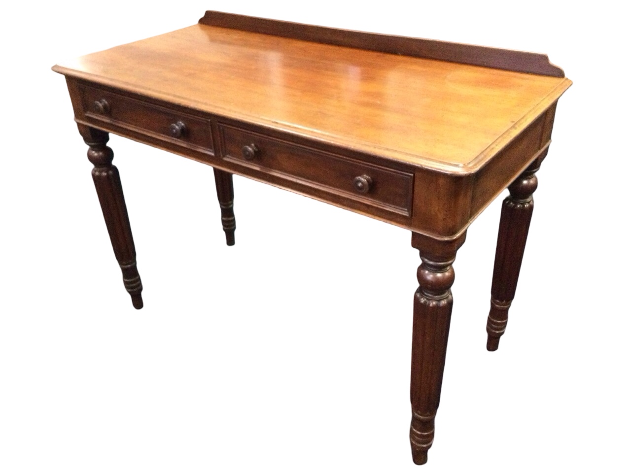 A Victorian mahogany side table, the low back above moulded top with two knobbed drawers, raised