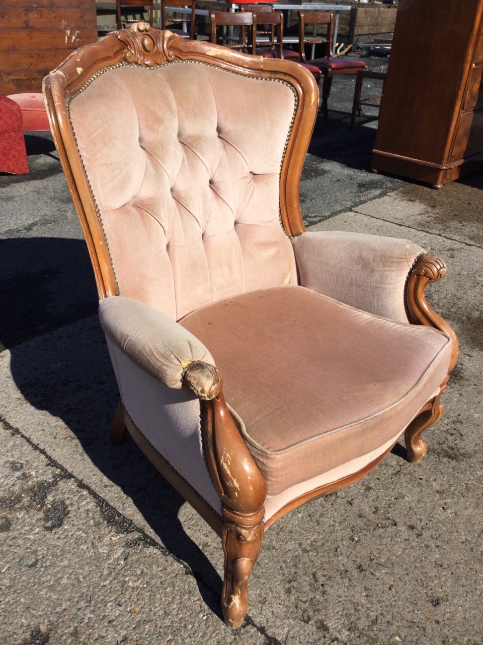 A Victorian style upholstered armchair with carved crestrail and buttoned back above a seat with - Image 3 of 3