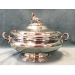 A large nineteenth century oval silver plated tureen & cover with gadrooned rim and handles, the lid