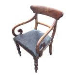 A Victorian mahogany armchair with shaped back above a plain rail having scrolled arms, with