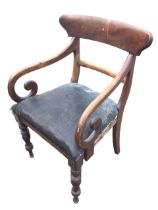 A Victorian mahogany armchair with shaped back above a plain rail having scrolled arms, with