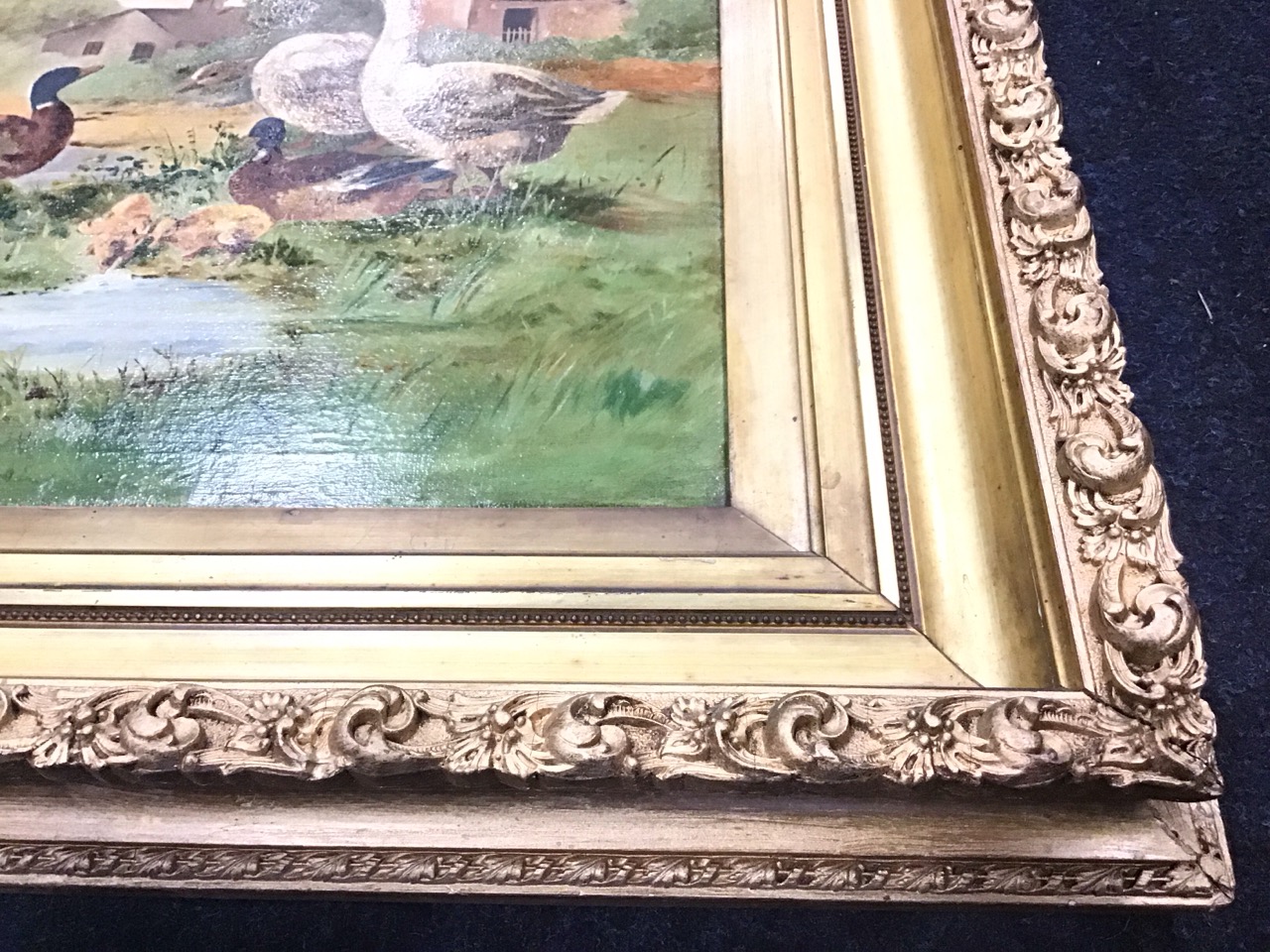 Victorian oil on canvas, geese, ducks and ducklings by a pond with farm buildings, unsigned, in a - Image 3 of 3